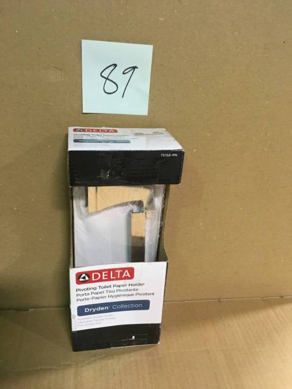 lot 89 image: Delta Dryden Pivoting Toilet Paper Holder in Polished Nickel in good condition