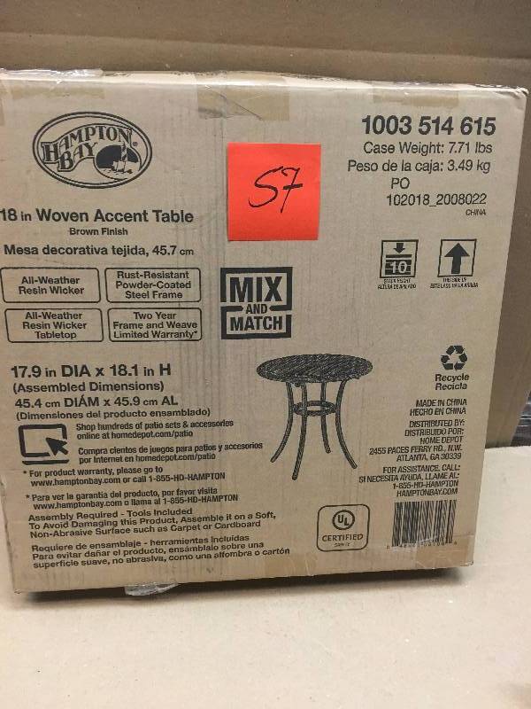 lot 57 image: Hampton Bay Dark Brown Wicker 18 in. Round Outdoor Accent Table not used