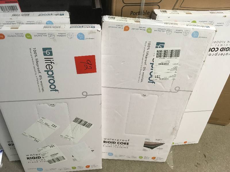 lot 92 image: LifeProof Brushed Chocolate 16 in. x 32 in. Luxury Vinyl Plank Flooring (24.89 sq. ft.  case) QTY 4 not used
