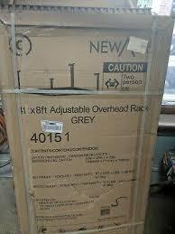 lot 139 image: Set of 2 NewAge Products Performance 96 in. L x 48 in. W x 42 in. H Adjustable VersaRac Ceiling Storage Rack in Gray not used