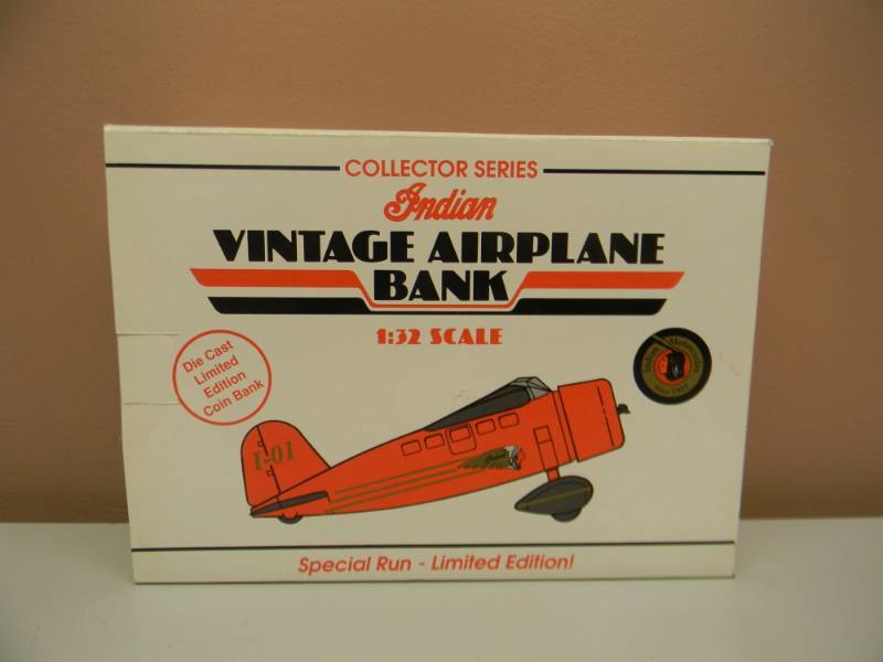 lot 35 image: COLLECTOR SERIES INDIAN MOTORCYCLES DIE CAST LIMITED EDITION AIRPLANE BANK 1932 LOCKHEED VEGA - NEW IN BOX - SEE PICTURES