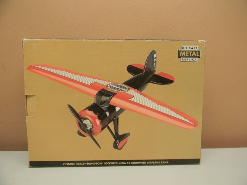 lot 38 image: HARLEY-DAVIDSON MOTORCYCLES DIE CAST LIMITED EDITION AIRPLANE BANK 1932 LOCKHEED VEGA 5B HIGHWING - NEW IN BOX - SEE PICTURES