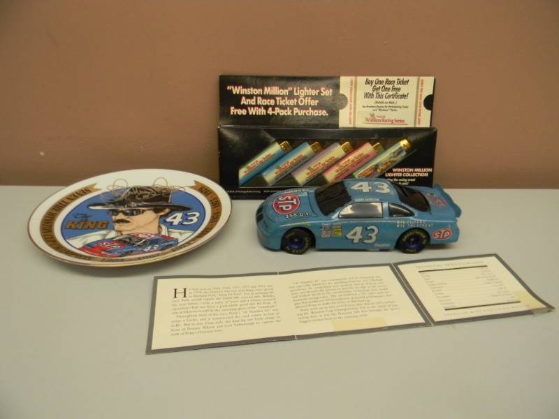 lot 42 image: RICHARD PETTY COLLECTION - RICHARD PETTY ACTION COIN BANK DIE CAST WKEY - Sports Image #43 The King Richard Petty Seven Time Winston Cup Champion Plate - WINSTON MILLION LIGHTER SET, NEW IN BOX - SEE PICTURES