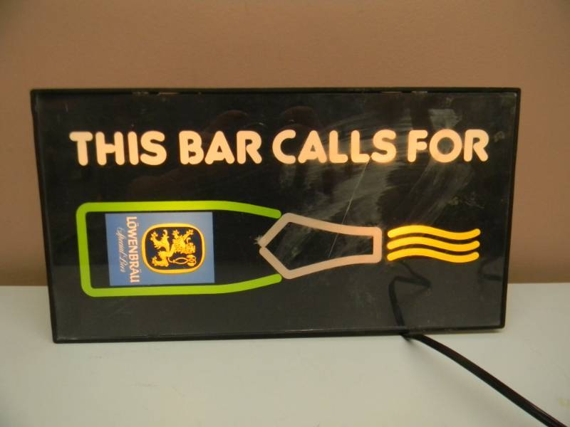 lot 16 image: LOWENBRAU LIGHTED BOTTLE SIGN - WORKS - APPROX 9 BY 16 - SEE PICTURES