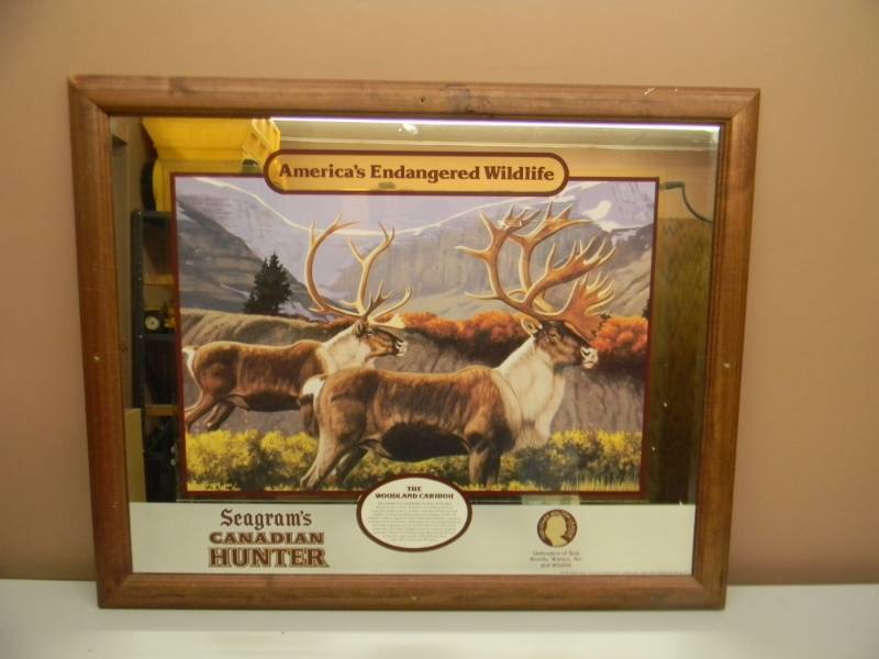 lot 38 image: SEAGRAMS CANADIAN HUNTER - CARIBOU FRAMED MIRROR - APPROX 25 BY 31 - SEE PICTURES