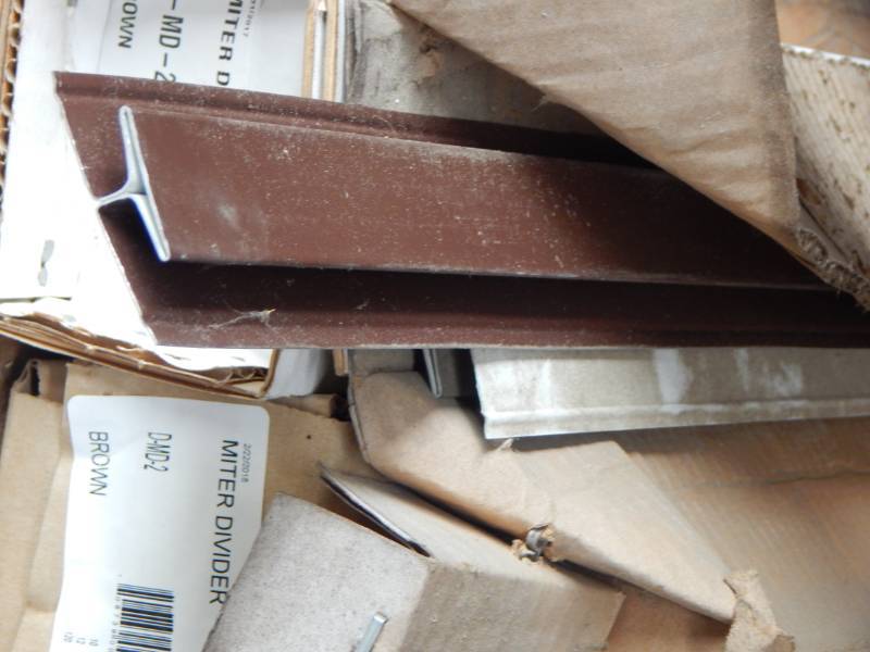 lot 27 image: Brown miter divider for soffits
