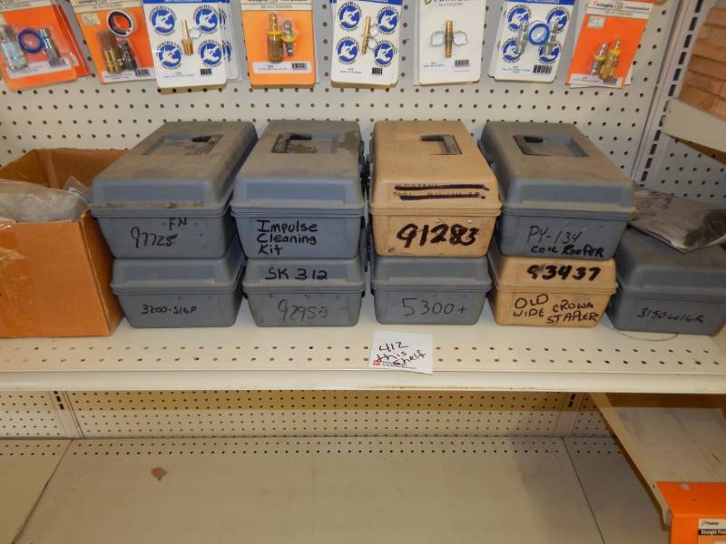 lot 412 image: Lot of Paslode tool repair kits with cases