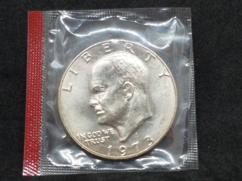 lot 14 image: 1973 D IKE Dollar in Mint Wrapper