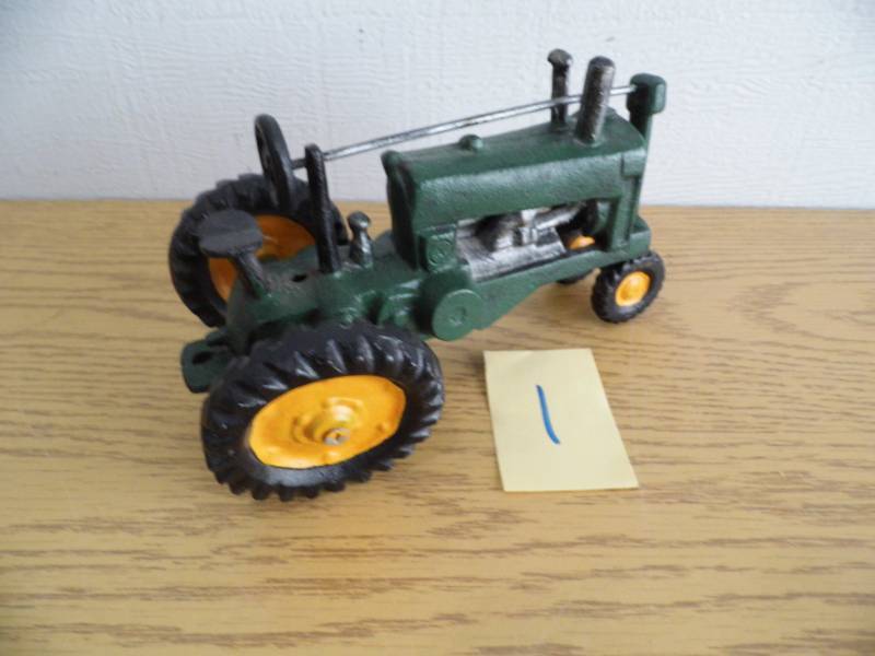 lot 1 image: Cast Iron Toy Tractor