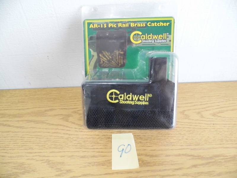 lot 90 image: Caldwell AR-15 Pic Rail Brass Catcher