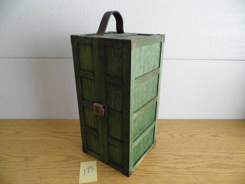 lot 173 image: Doll in Trunk
