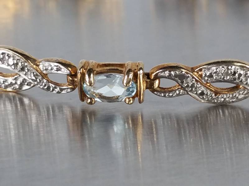 Elegant Swiss Blue Topaz and Diamond Bracelet in Sterling Silver