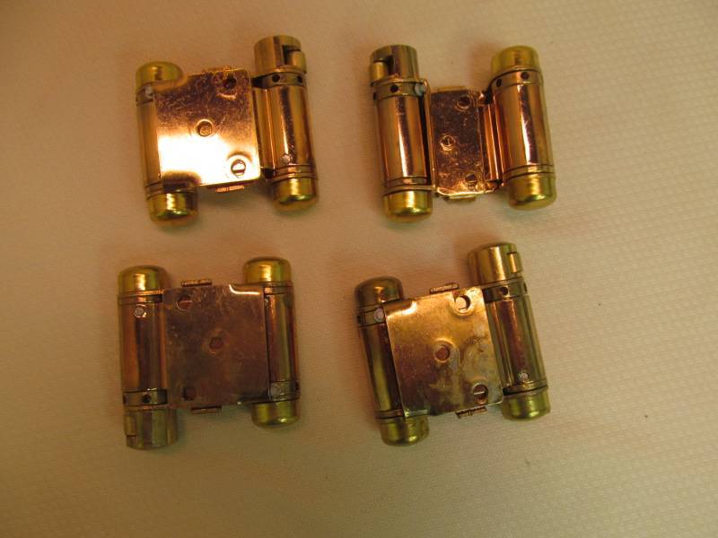 lot 18 image: (4) Brass Finish 2 Way Swinging Door Hinges