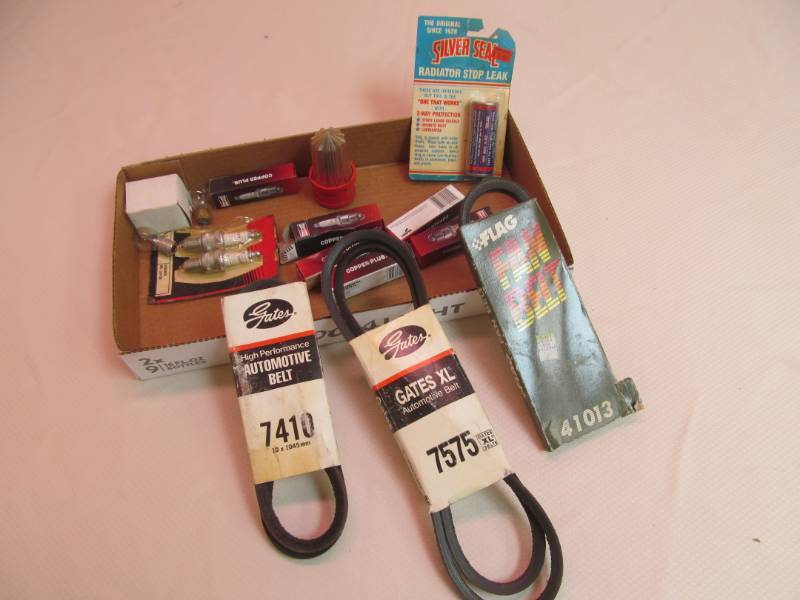 lot 19 image: (6) Sparkplugs, (3) V-Belts, (3) 1157 Bulbs, Battery Post Cleaner