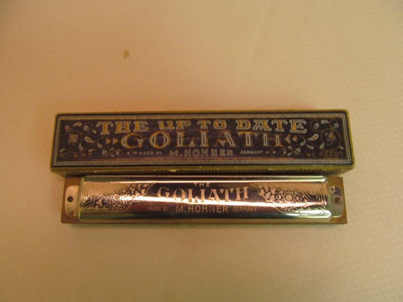 lot 98 image: Vintage The Up To Date Goliath Harmonica - M. Hohner