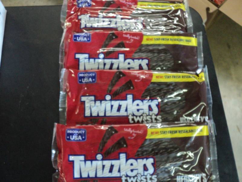 lot 325 image: 4 Bags Twizzlers Hersheys Chocolat...