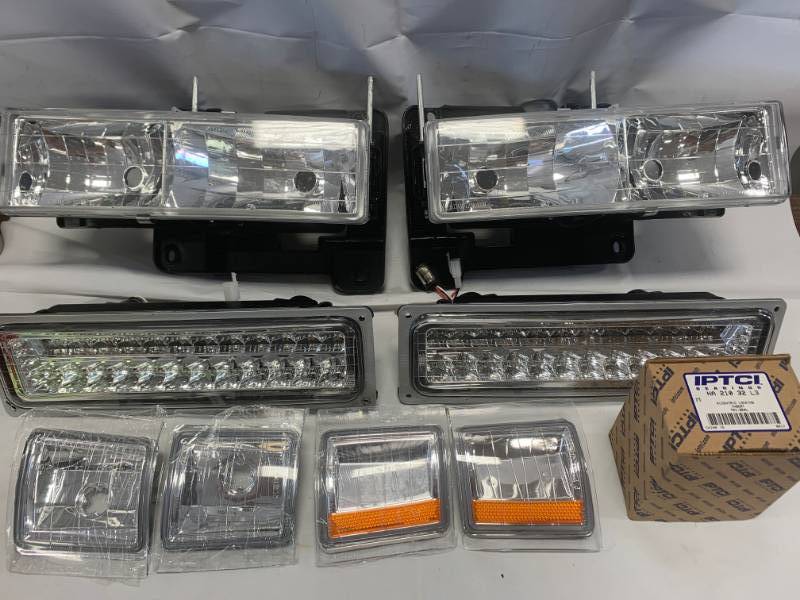 lot 85 image: GMC Grill & Headlight Part New