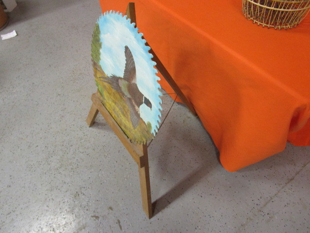 lot 64 image: Painted Buck Saw Blade & Stand
