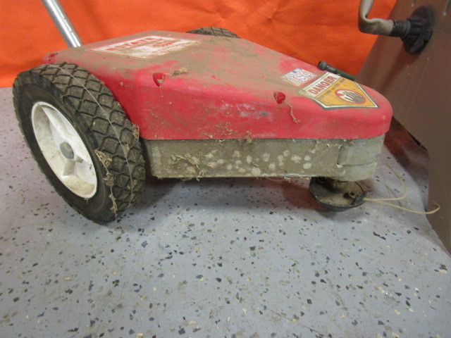 lot 34 image: 12v Rechargeable Trimmer & Hose Reel