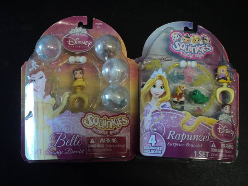 lot 87 image: Set of 2 Squinkies- Belle and Rapun...