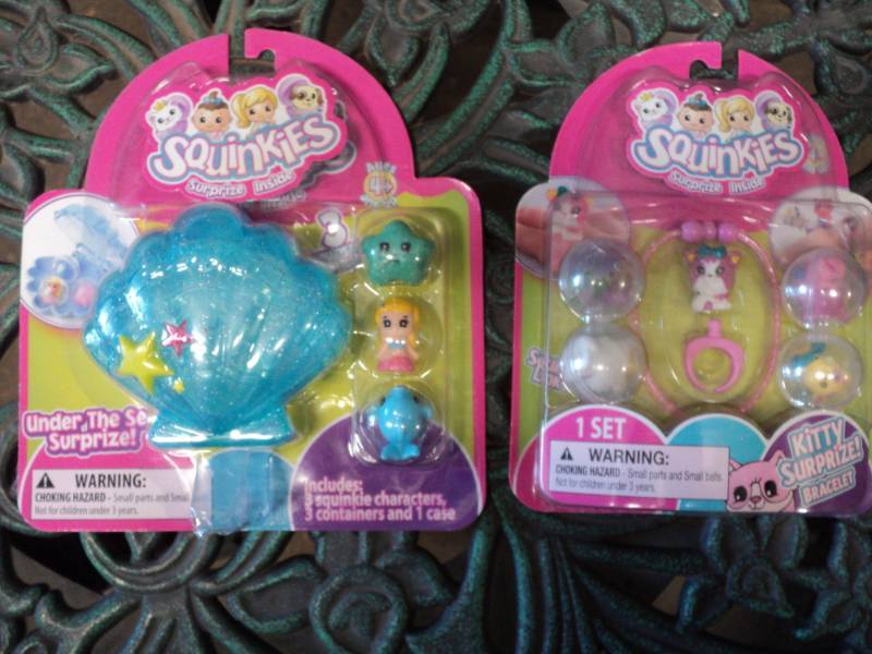 lot 123 image: Set of 2 squinkies...