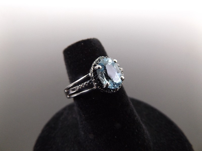 lot 48 image: .925 Sterling Silver Faceted Topaz Ring Size 5