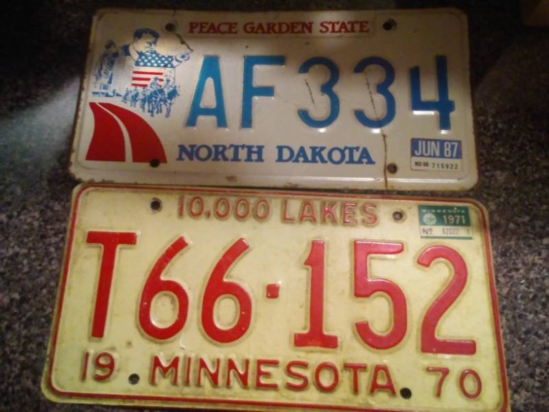 lot 22 image: North Dakota and Minnesota (1970) license plate.