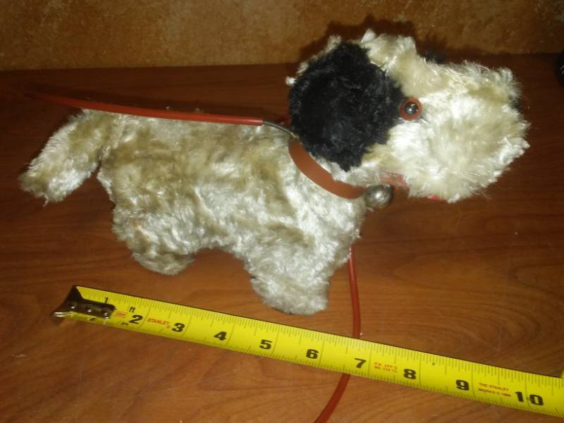 lot 31 image: Vintage Air or wire controlled barking dog. Amazing find - pre battery Toys.