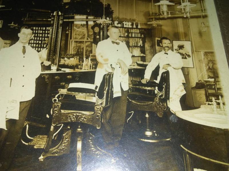 lot 81 image: vintage photograph Barber Shop, age unknown.