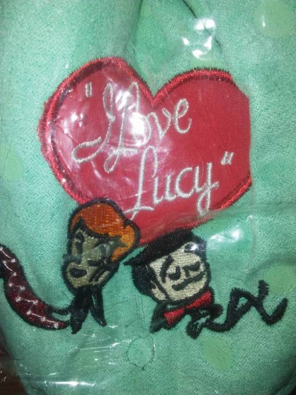 lot 174 image: Misc. Cool, I love Lucy Slippers (New), belt buckle,