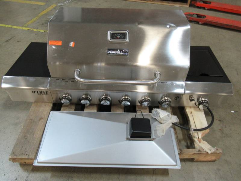 lot 69 image: Nexgrill Nexgrill Deluxe 6-Burner Propane Gas Grill in Black with Side Burner 720-0898, Dent on Lid Missing Stand and Warming Rack.