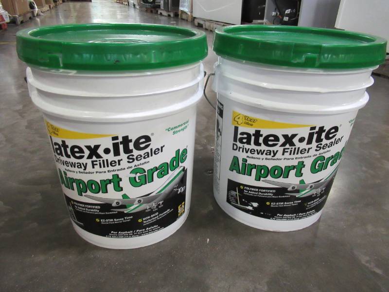 lot 134 image: 2 containers of Latex-ite 4.75 Gal. Airport Grade Driveway Filler Sealer. Model 73066