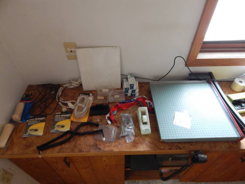 lot 93 image: Heavy Duty Paper Cutter, APC power supply, and office supply lot