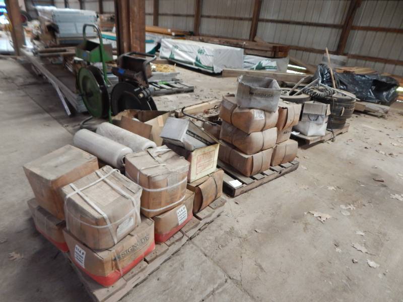 lot 229 image: Pallets of steel banding, banding clips, and three banding carts with tools