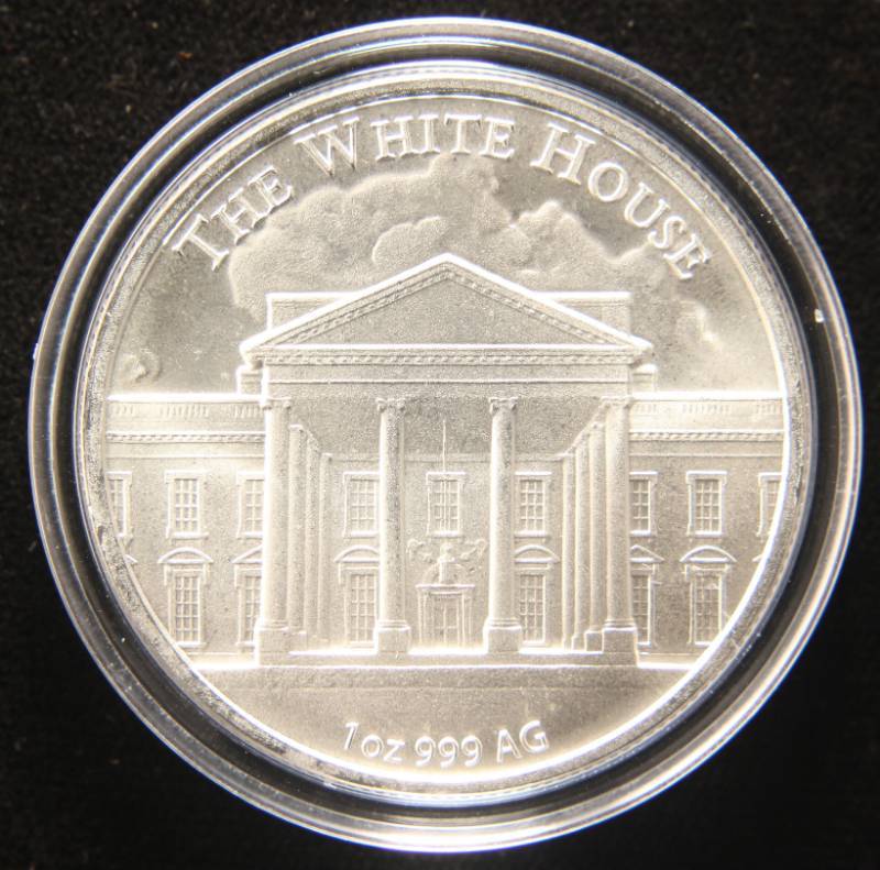 lot 38 image: 1 TROY OZ. .999 FINE SILVER DONALD TRUMP ROUND IN AIRTITE HOLDER
