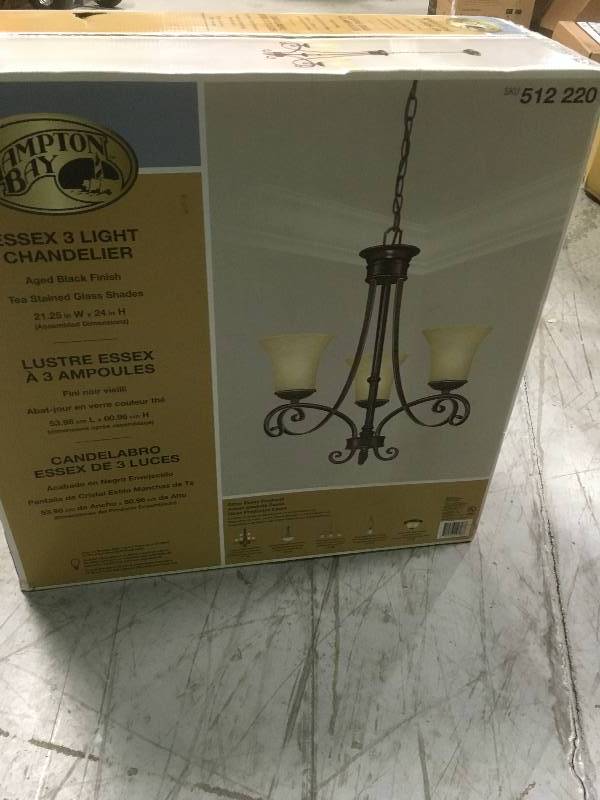 lot 65 image: Hampton Bay Essex 3-Light Aged Black Chandelier with Tea Stained Glass Shades  in good condition