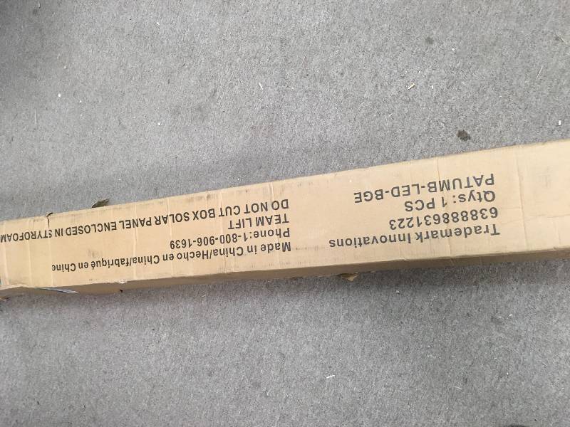 lot 43 image: Trademark Innovations 9 ft. Deluxe Solar Powered LED Lighted Patio Umbrella in Beige not used