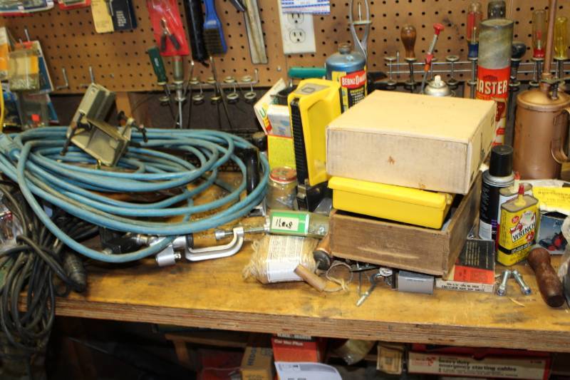 lot 56 image: Wheels, Grinder, Garden Hose, Propane Tank, Float Charger, Hammers, Clamps, Hardware, Work Gloves, 3M Adhesive Gun, and more