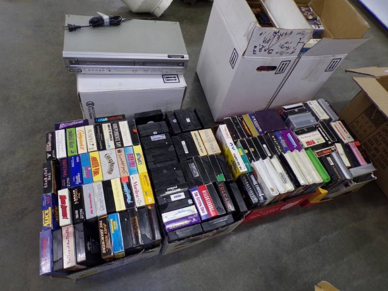 lot 121 image: 7 Large Boxes of VHS Tapes with VHS  DVD Player