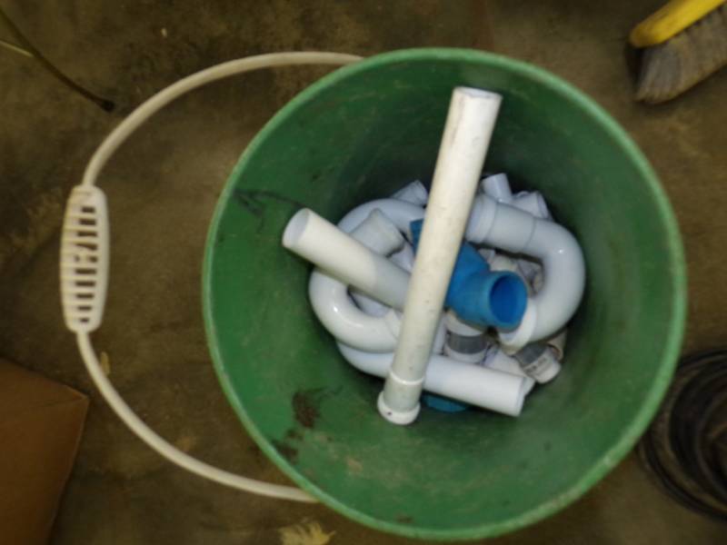 lot 144 image: Pail with Plumbing Supplies