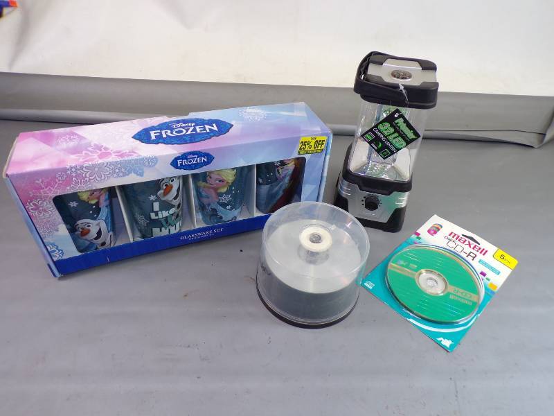 lot 198 image: Frozen Glasses, LED Lantern, and CDs