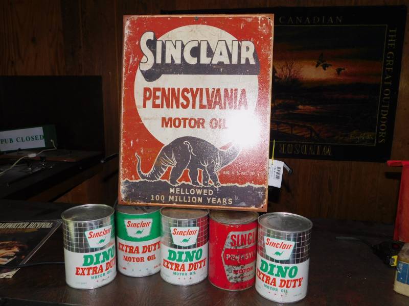 lot 12 image: Sinclair Motor Oil Unopened Cans and Metal Sign