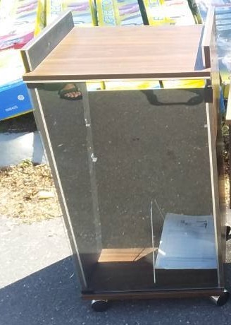lot 17 image: Glass Door Stereo Cabinet 18x16x35 (On Wheels)