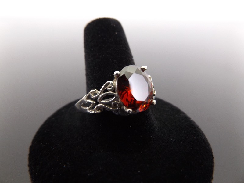 lot 61 image: .925 Sterling Silver Faceted Garnet Ring Size 10.75