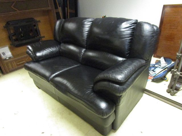 lot 119 image: BLACK VINYL COUCH