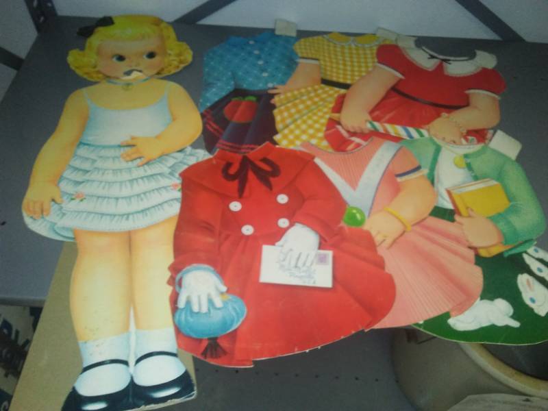 lot 288 image: Vintage cardboard cutout doll and 6 dresses