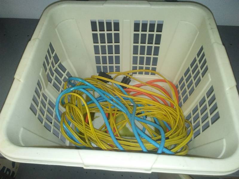 lot 308 image: Basket and three extension cords.