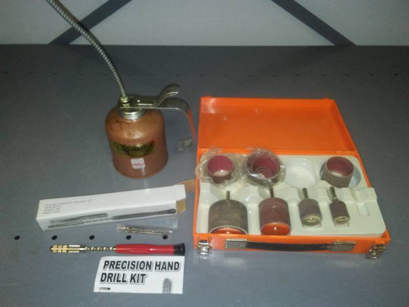 lot 315 image: Oil can, drum sander, drill kit.