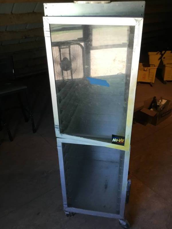 lot 67 image: NuVu bread cabinet on wheels, one handle missing.
