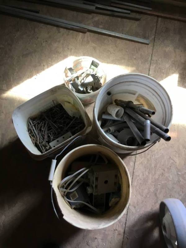 lot 118 image: 4 pails electrical, plumbing, pole barn nails, brackets.